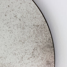 Orbis™ Antiqued Round Mirror with a Handcrafted Bronze Patina Frame